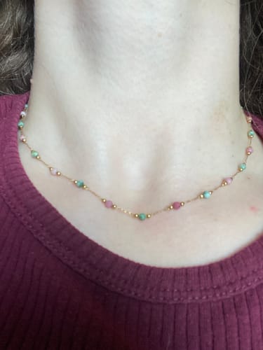 Customer wearing the dainty Lulu Spring Beaded Stone Necklace with pink and green beads.