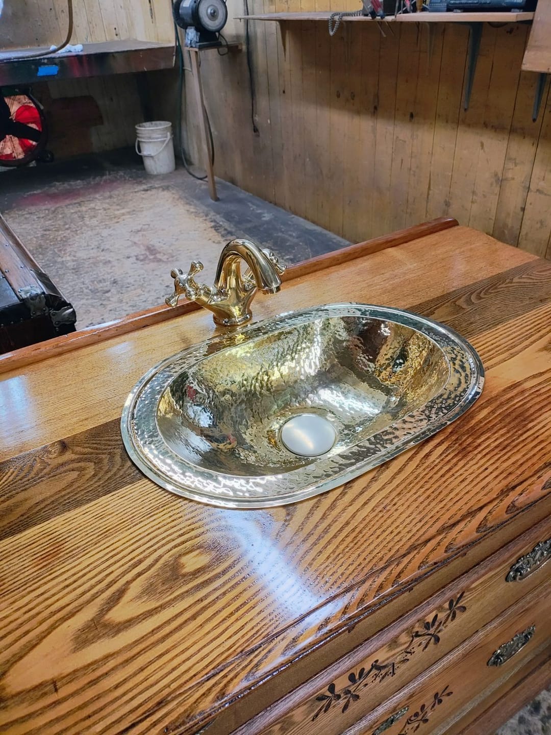 Kathleen T's bathroom vanity with hand crafted brass sink and matching faucet, Loox verified review