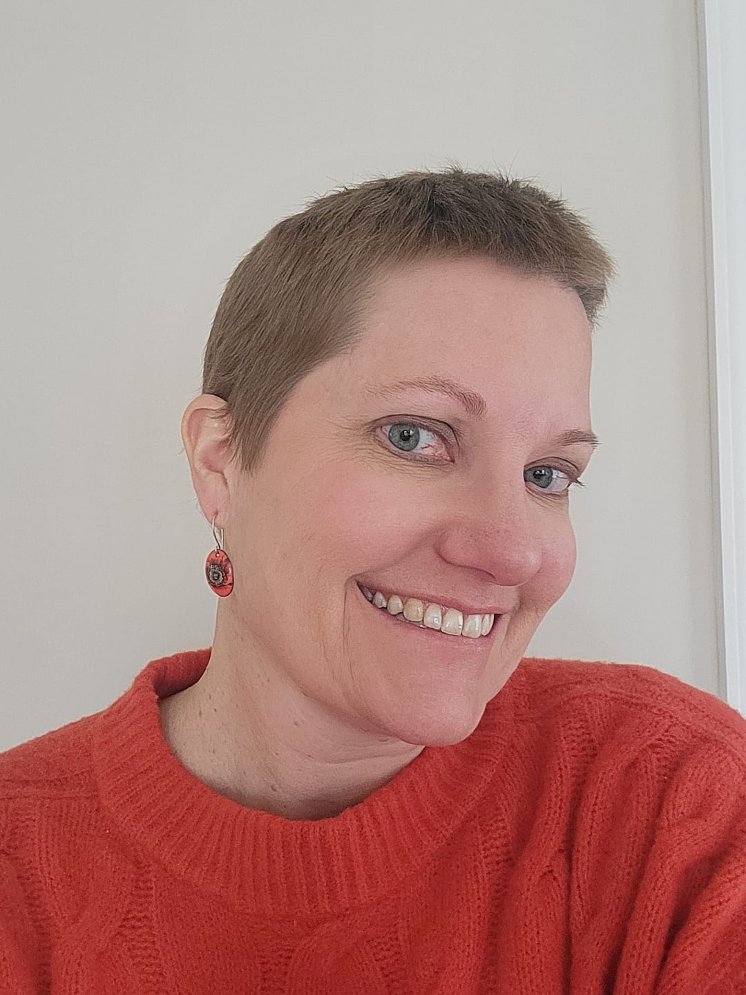 Customer photo review of Poppy Earrings – August Birthday Flower.