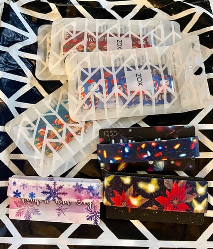 Customer's festive bands from The Enchanted Mountain Advent Calendar, showing snowflake and poinsettia patterns.