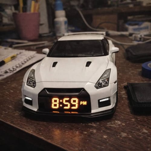 Customer's white Hypercar Alarm Clock on a desk, with the LED display showing 8:59 PM.