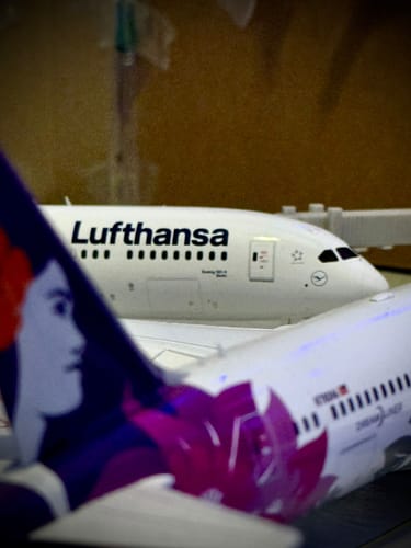 Close-up of the customer's white GEMINI200 Lufthansa 787-9 model airplane, with the cockpit and Lufthansa logo visible.