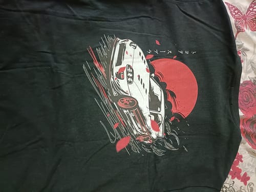 Customer's black Supra MK4 T-Shirt showing the awesome Japanese-style graphic of a white car and red sun.