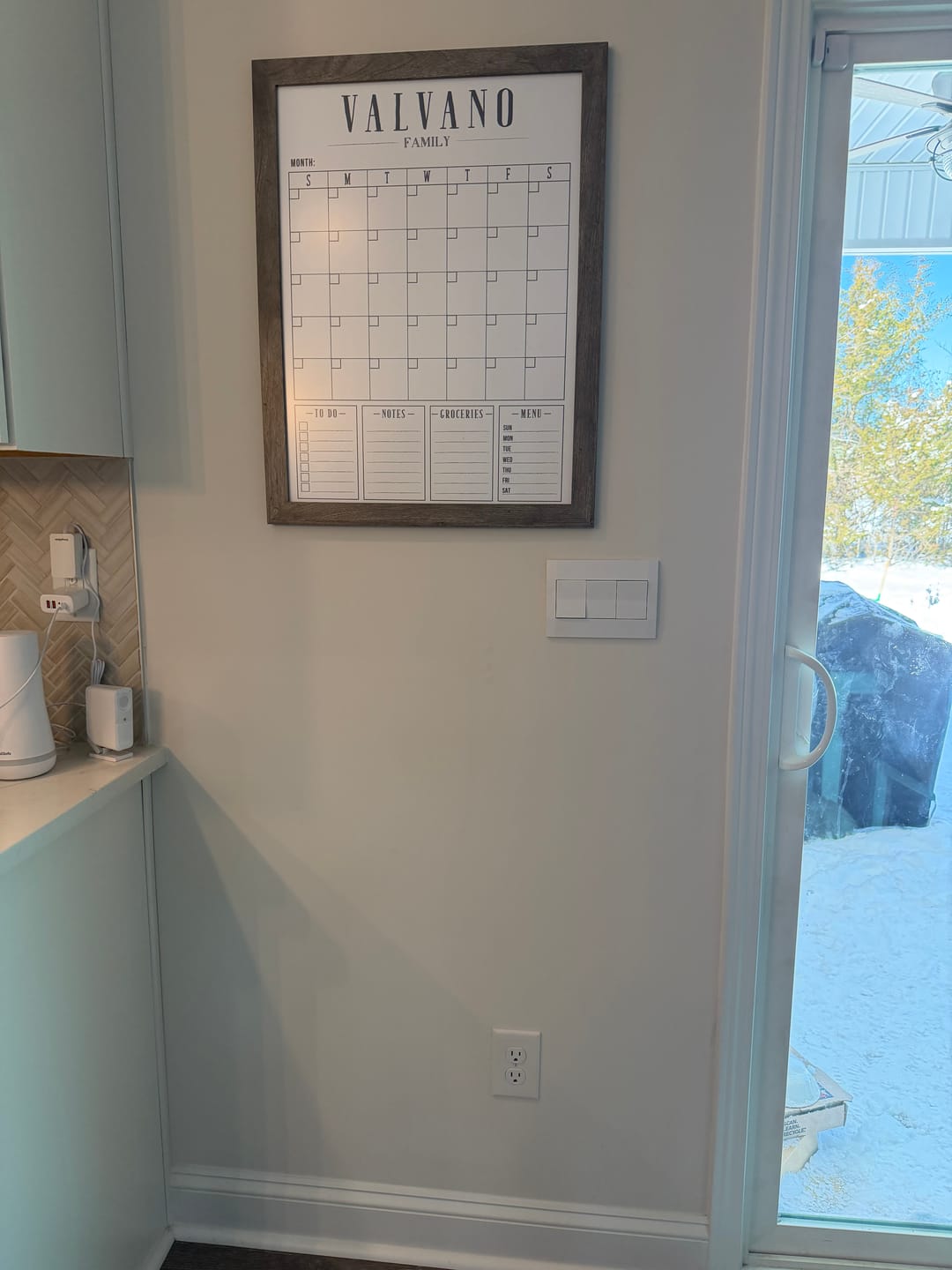 Customer photo review of Monthly Framed Whiteboard Calendar + 4 sections | Vertical Swanson