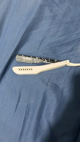 Customer photo review of Porta Navaja Rhino Blanco y Negro