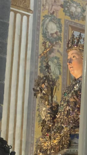 Reviewer's image for the Necklace: Legacy review showing a decorated statue.