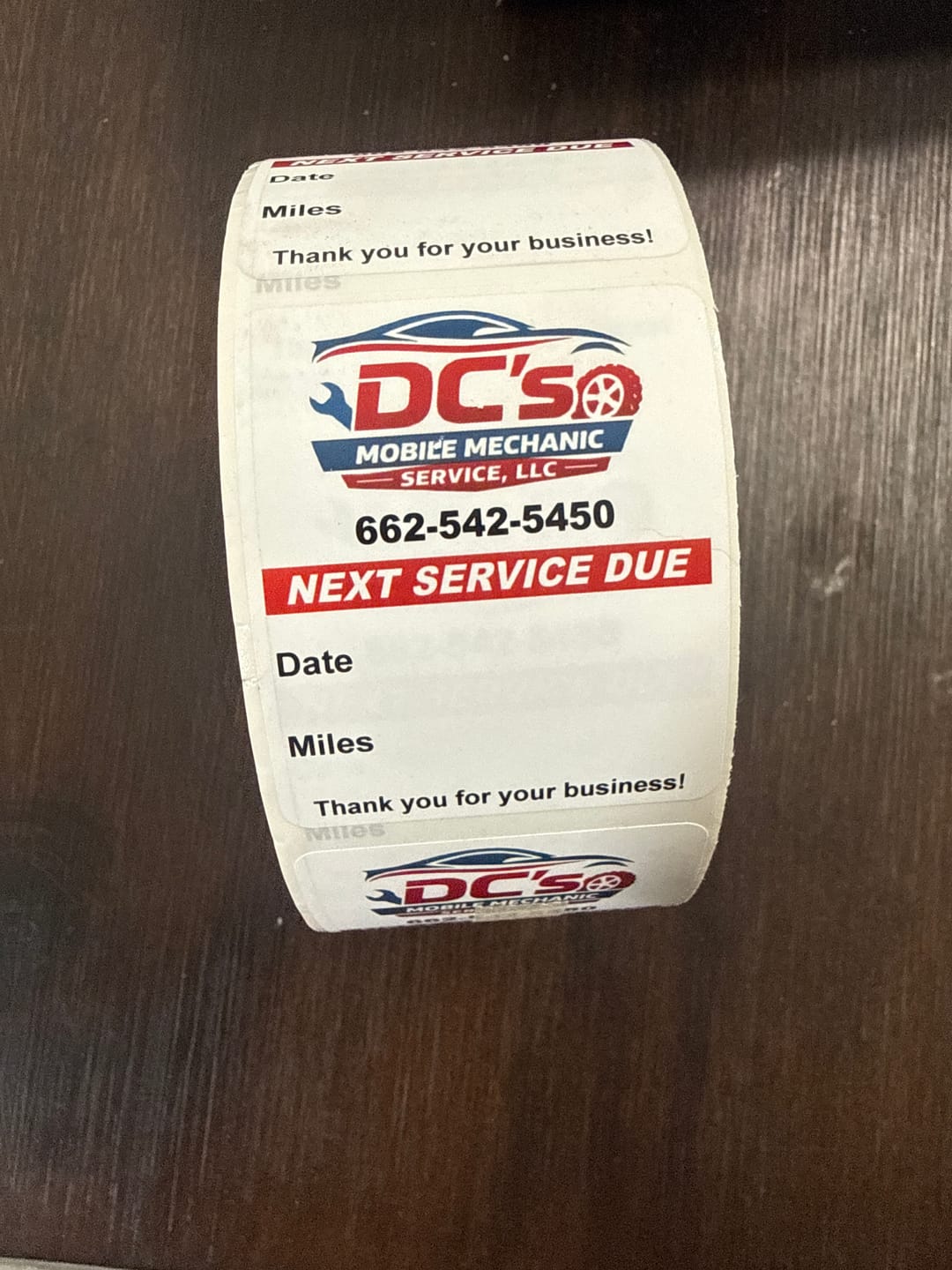 Customer photo review of Custom Oil Change Stickers for Windshield with Logo