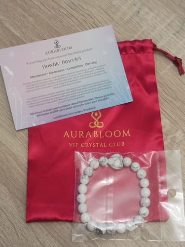 Customer's Howlite bracelet from the VIP Crystal Club, shown with its red satin pouch and info card.