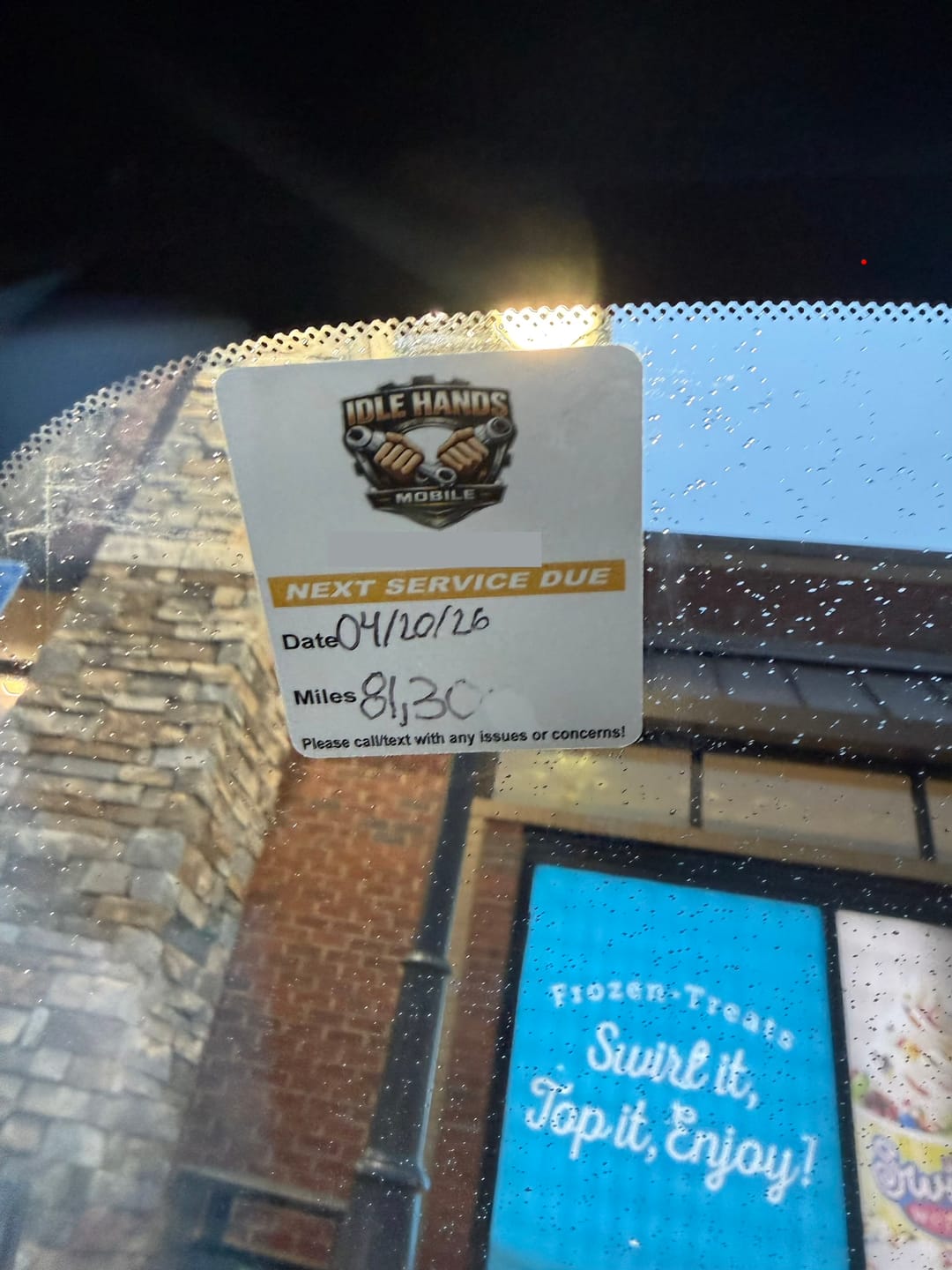 Customer photo review of Custom Oil Change Stickers for Windshield with Logo
