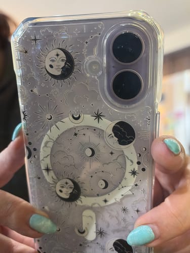 Customer holding their phone in the Milky Way White Clear Case, showing the detailed celestial pattern.