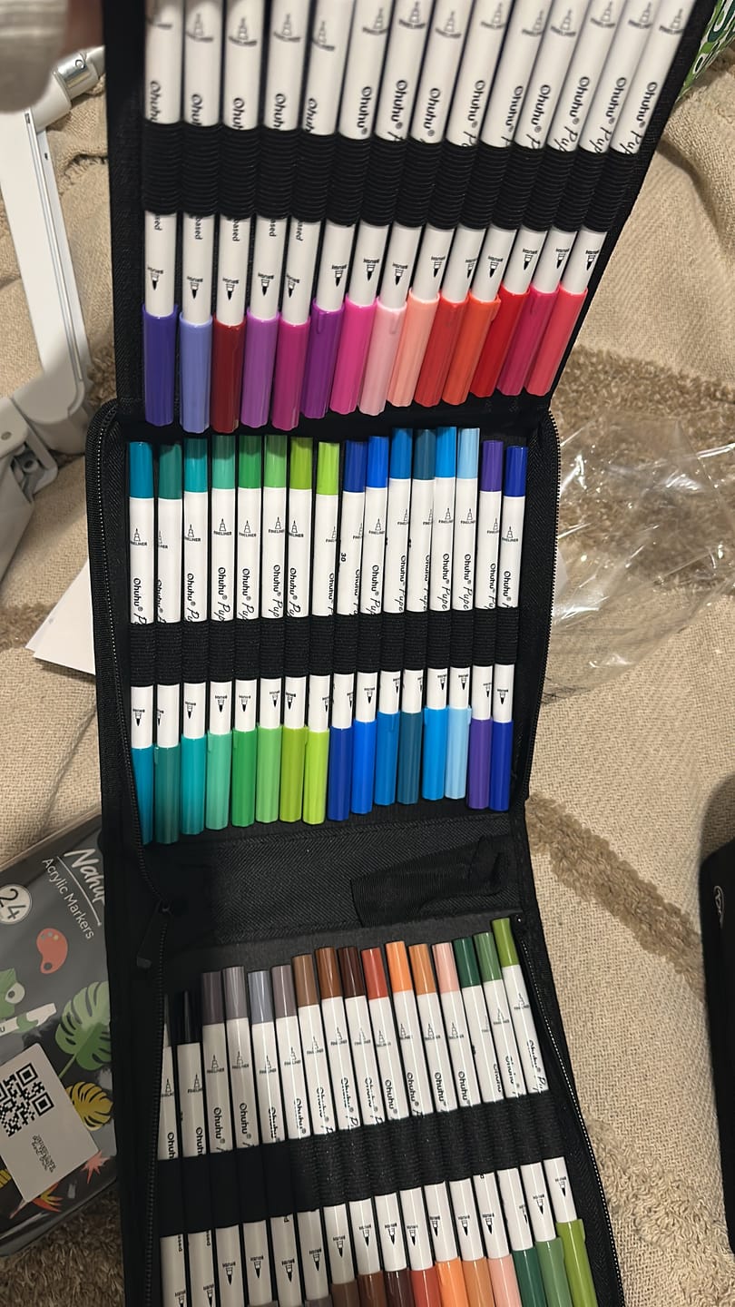 Customer photo review of Ohuhu Pupe Paper-friendly (No Peeling) Brush and Fineliner Dual Tips 60 Colors Water-based Coloring Markers