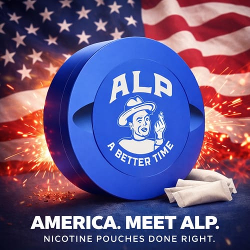Customer's royal blue Metal Travel Tin with the ALP logo, shown with pouches in front of an American flag and sparks.