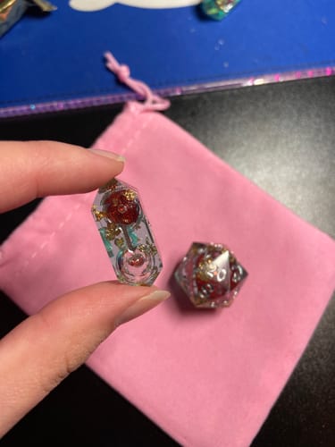 Customer photo review of Red And Gold Glitter Liquid Core Handmade Resin DND Dice Set