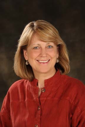 A smiling reviewer providing a headshot for their Boomer Boost review.