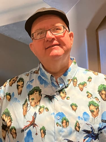 Customer wearing the Avatar 'Hallelujah Mountains' shirt with its floating islands pattern.