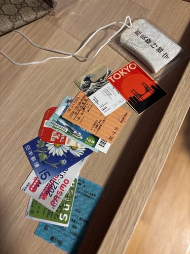 Reviewer's Mystery Gift, a collection of Japanese-themed paper goods and a small charm, laid out on a table.