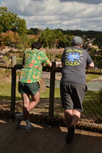 Customer from behind wearing the 'Aloha Stitch' Crewneck Tee, showing the 'Experiment 626' graphic on the back.