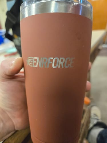 Customer holding their reddish-brown 20 OZ Soft Matte Tumbler.