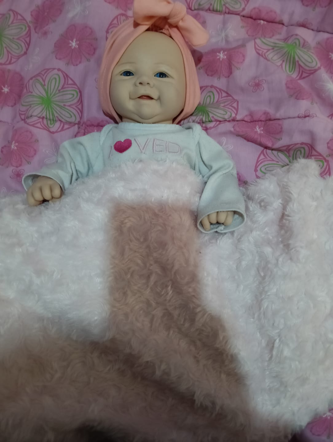 Customer photo review of Bambola reborn 44cm che sorride 100% silicone morbido - YANE