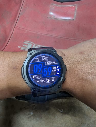 Reviewer wearing the rugged Gard Pro Ultra 3 smartwatch on their wrist in a work environment.