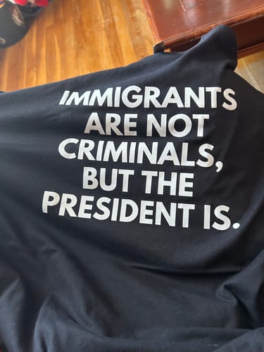 Customer photo review of Immigrants Premium Unisex T-Shirt