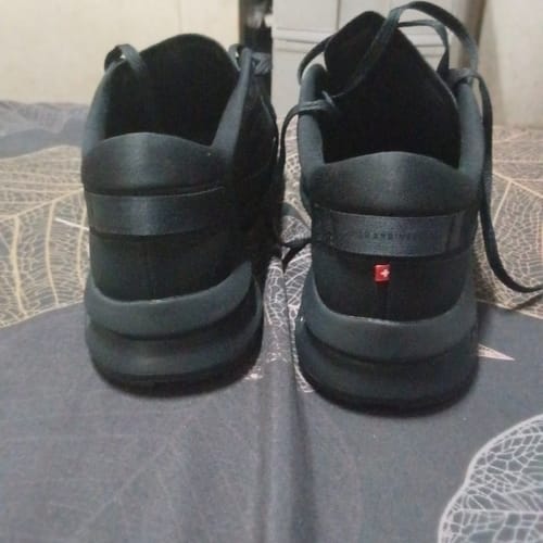 Customer's black On Cloudzone Men's Casual Shoes shown from the back, highlighting the heel design.