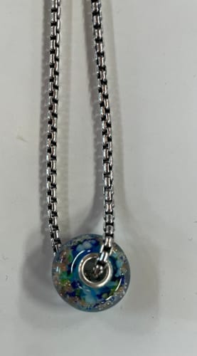 Customer's blue glass cremation bead on a silver box chain.