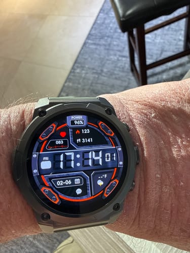 A customer's Gard Pro Ultra 3 smartwatch on their wrist, showing a digital face with health and activity data.