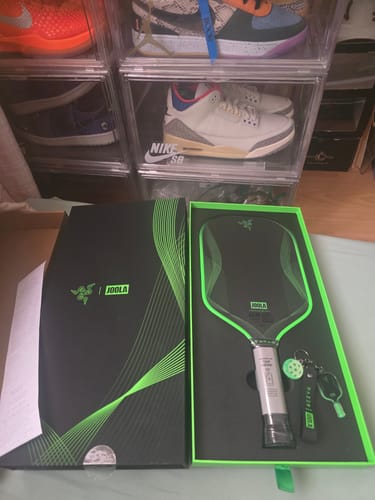 Customer's black and green JOOLA Razer Perseus Pro IV Pickleball Paddle displayed in its open packaging.