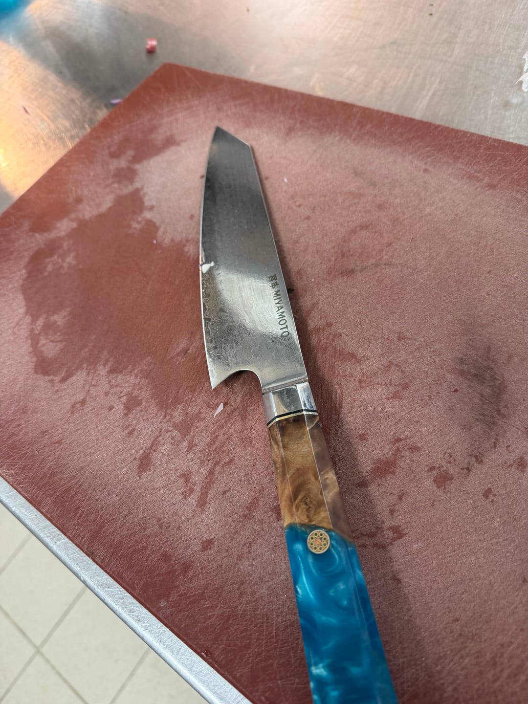 Customer photo review of Miyamoto Damascus Kiritsuke Chef Knife with Blue Resin Handle