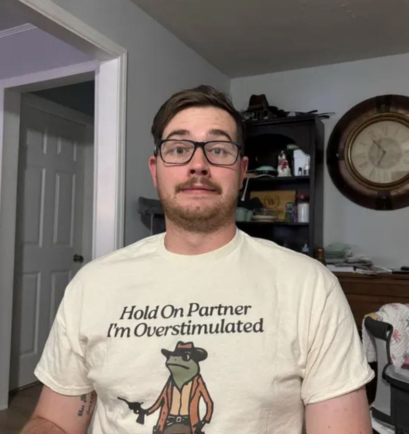 Customer photo review of Hold On Partner I'm Overstimulated Cowboy Frog T-Shirt