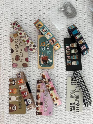 Customer's seven different bracelets from the Coffee Collection laid out with their matching backer cards.