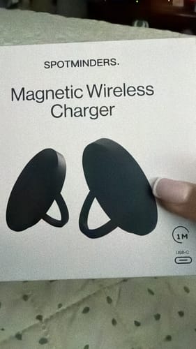 Reviewer showing the packaging for their SPOTMINDERS Magnetic Wireless Charger.