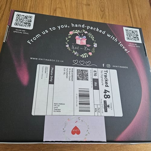 Customer's shipping box for the Enchanted Garden knitting box, showing the branding and shipping label.