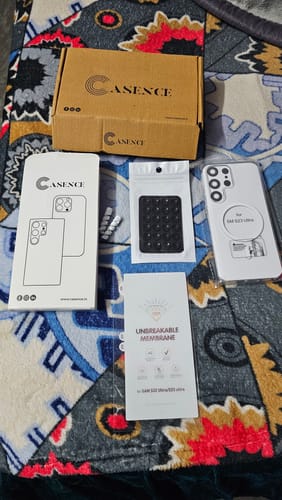 Reviewer's new Anti Yellow Magsafe Clear Case for Samsung displayed with its box and all included accessories.