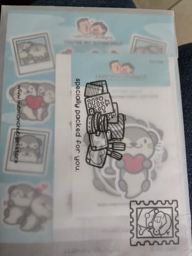 Customer's My Otter Half Sticker Set in its original packaging, showing cute otter designs through a vellum envelope.