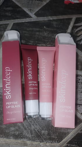 Customer's two Peptide Lip Glaze tubes in Deep Berry and Pink Rose, displayed next to their packaging.