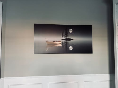 Customer's Night Lake Wall Art hanging on a light gray wall with white wainscoting.