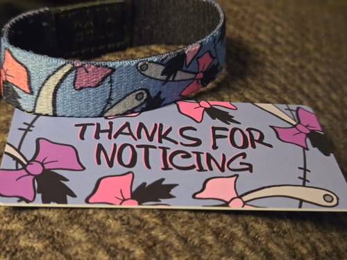 Customer's Thanks for Noticing Bracelet with an Eeyore tail design, shown with its matching themed card.