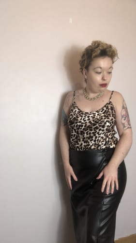 Customer showing a side view of the leopard brown Cordelia Satin Vest.