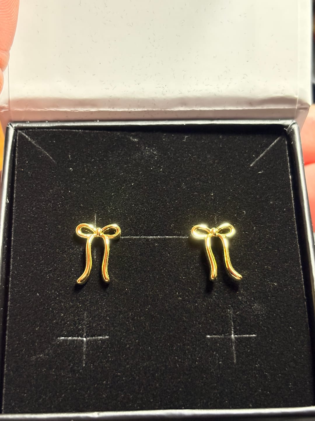 Customer photo review of Lola 18k White Gold Plated Ribbon/Bow Drop Earrings