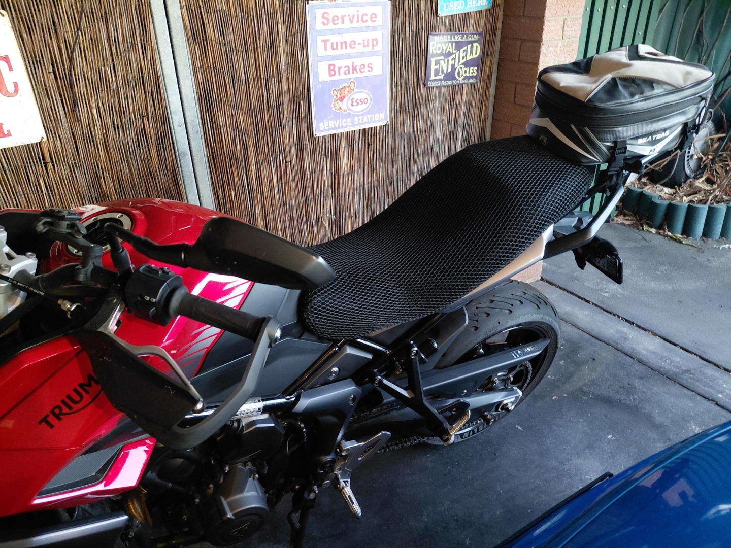Wind Rider mesh seat cover installed on a Triumph Tiger Sport 660