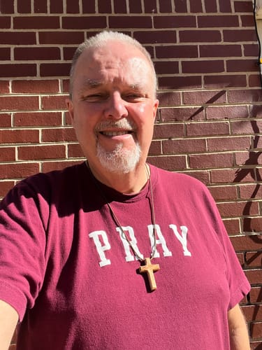 Customer photo review of Holy Land Plain Olive Wood Cross Pendant