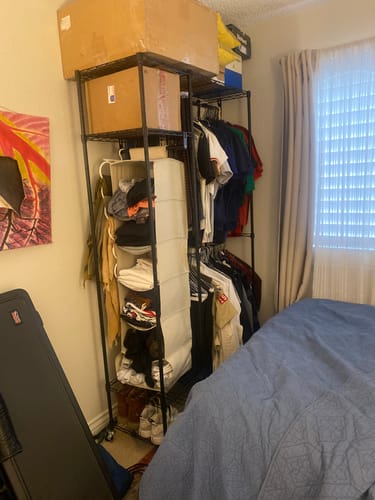 Customer photo review of Raybee Heavy Duty Portable Closet, Wire Garment Rack on wheels, Adjustable Hanging Clothes Rack, For Bedroom