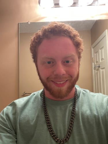 Reviewer wearing the thick Knights Templar Cuban Link Necklace with an antique finish.