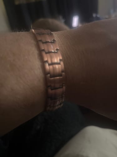 Customer's close-up of the Vitalis Copper Magnetic Bracelet on their wrist.