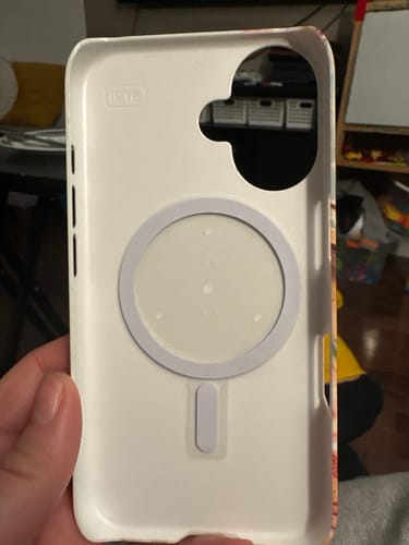 Customer showing the MagSafe ring installed on the inside of a white phone case.