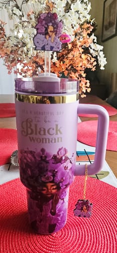 Customer's purple 'Royalty Blossomed' tumbler showing its illustration, text, and included straw topper and charm.