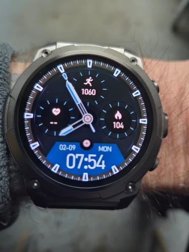 Close-up of a customer's Gard Pro Ultra 3 smartwatch on their wrist, showing the detailed digital watch face.
