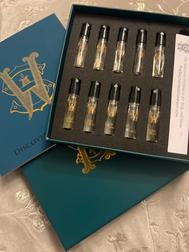 Reviewer's Discovery Set in its elegant teal box, with ten glass perfume vials neatly arranged.